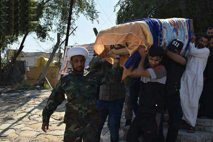 بالصور... تشييع أصغر شهيد بالحشد الشعبي 