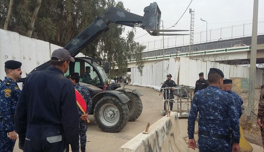  بالصور.. شارع حيوي قرب طريق مطار بغداد يودع الكتل الكونكريتية