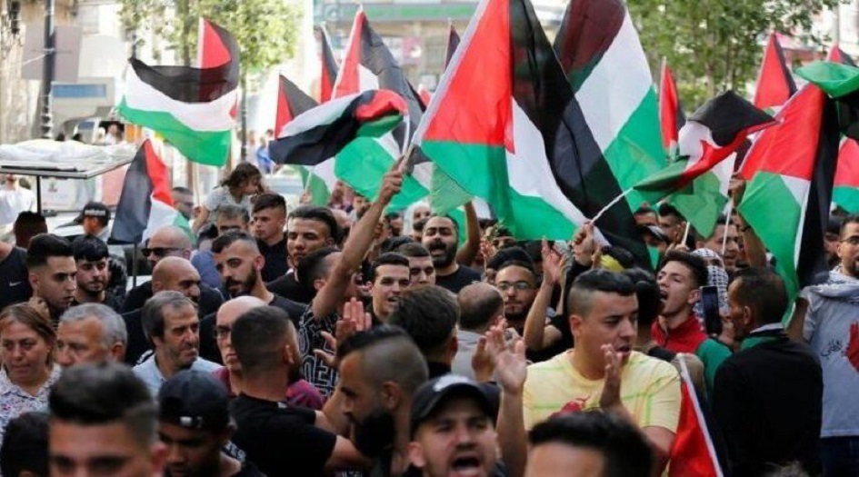 تنديداً بزيارة بايدن... الجهاد الاسلامي تنظم مسيرة في رام الله