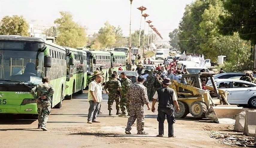 خروج 1184 من المسلحين وعوائلهم من حي الوعر بحمص في إطار اتفاق المصالحة