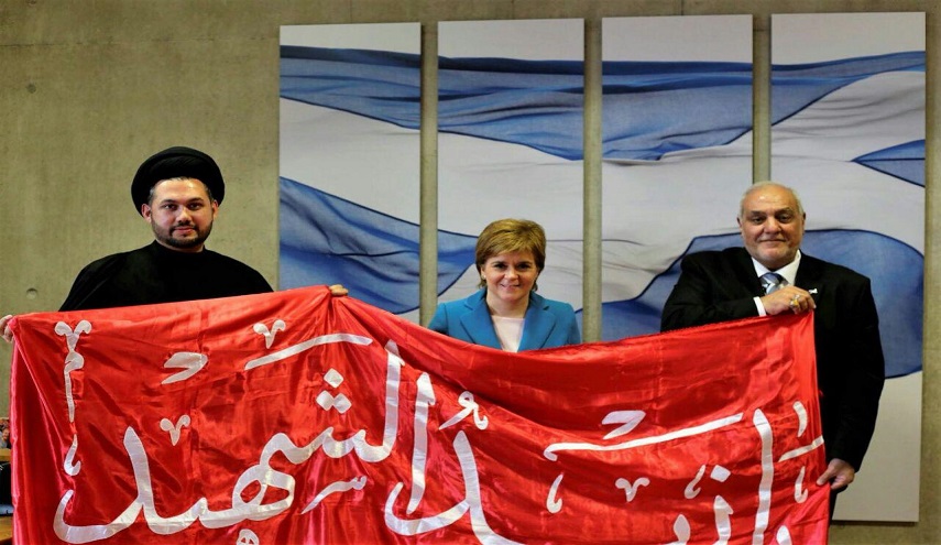 رئيسة وزراء اسكتلندا تطلب راية الامام الحسين (ع).. وتستمع الى قصة استشهاده
