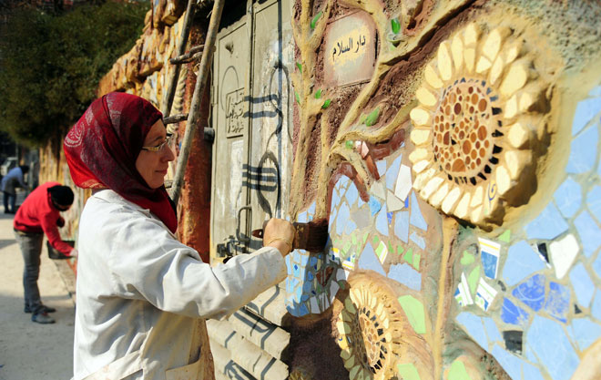 بالصور: الفن التشكيلي في شوارع دمشق.. رسالة محبة وسلام