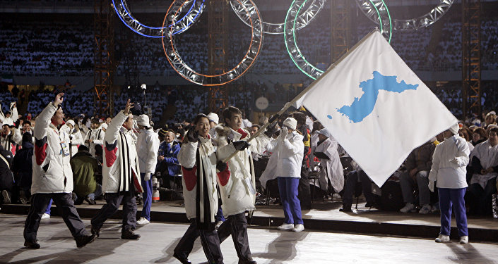 حضور دوکره با یک پرچم در بازی‌های المپیک زمستانی