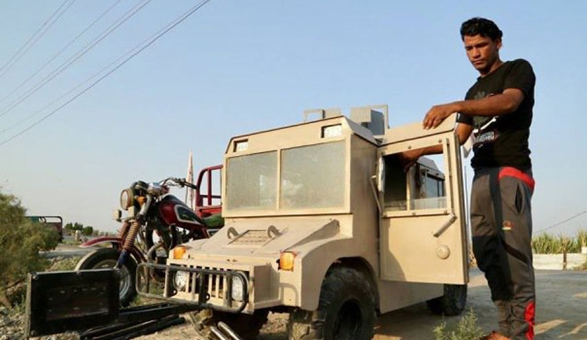 بالصور.. عراقي يصنع "هامر عسكرية" بمحرك دراجة!