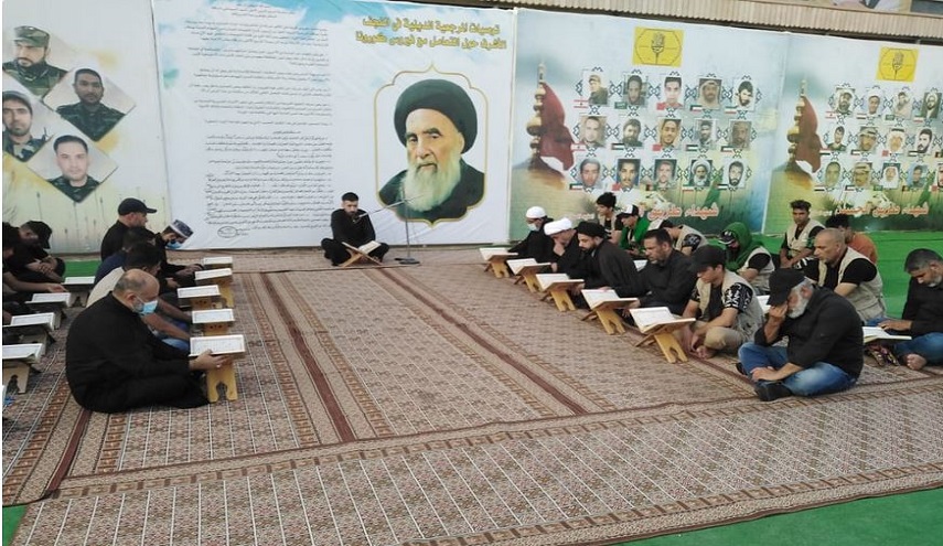 بالصور...موكب كتائب حزب الله يقيم محفلاً قرآنياً على طريق  يا حسين"