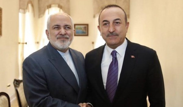 ظريف واوغلو يبحثان توطيد العلاقات بين ايران وتركيا