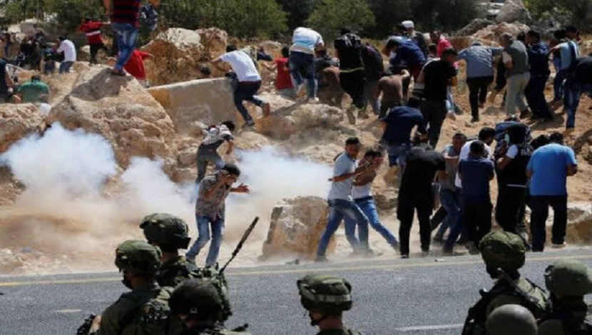 إصابة مئات الفلسطينيين برصاص الاحتلال في تصديهم لمسيرة الاعلام الصهيونية